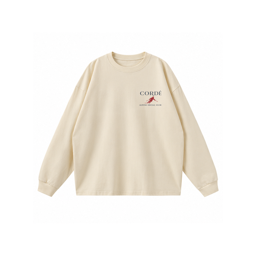CORDÉ Cream longsleeve, front: CORDÉ logo and small red skier.