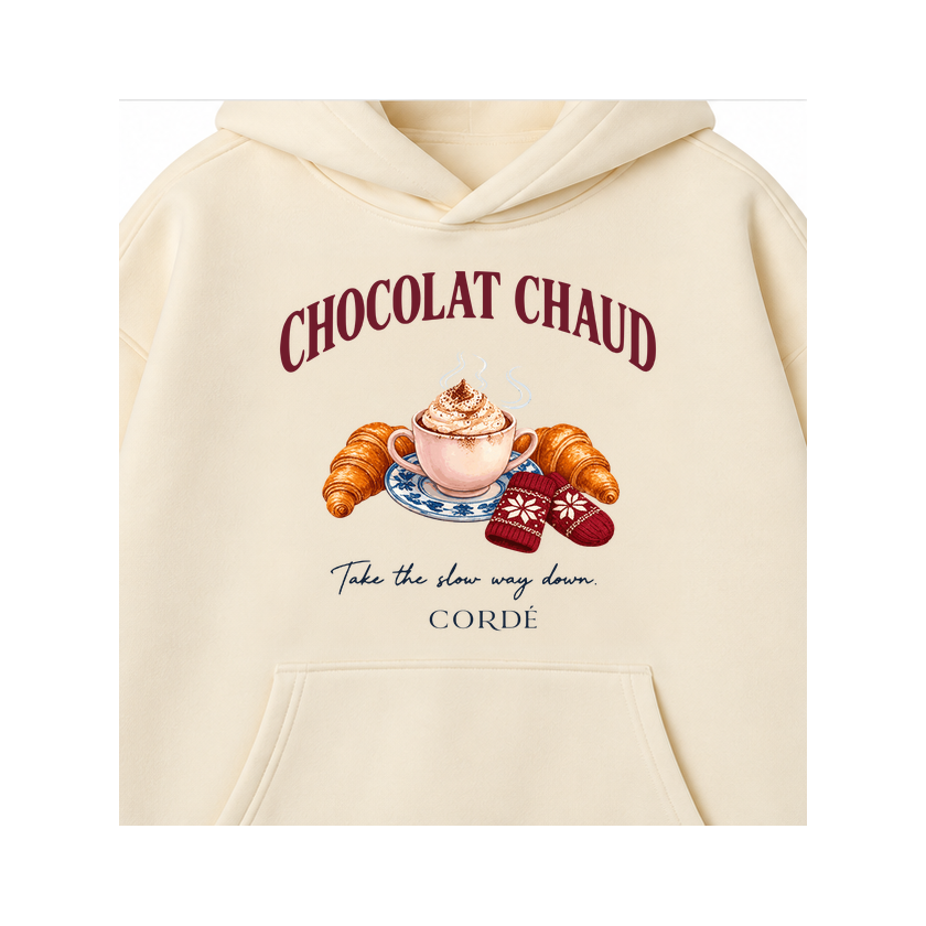 CORDÉ Cream hoodie, front detail: Chocolat Chaud lettering, hot chocolate and croissants.