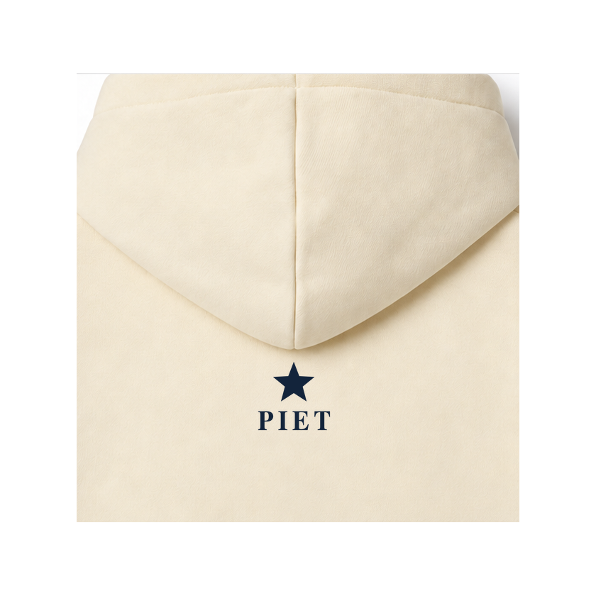 CORDÉ Cream hoodie, back detail: small navy star and Piet signature.