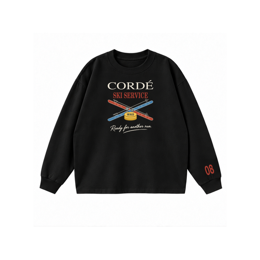 CORDÉ Black longsleeve, front: CORDÉ Ski Service lettering, crossed skis and wax tin.