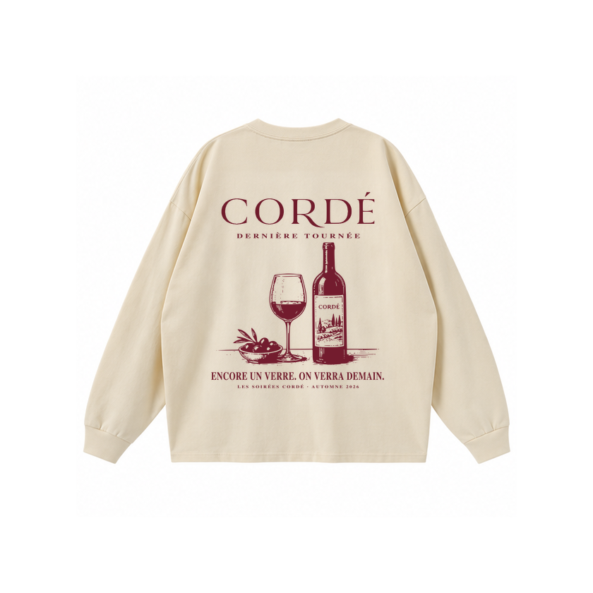 CORDÉ Cream longsleeve, back: wine bottle, wine glass and bowl of olives.