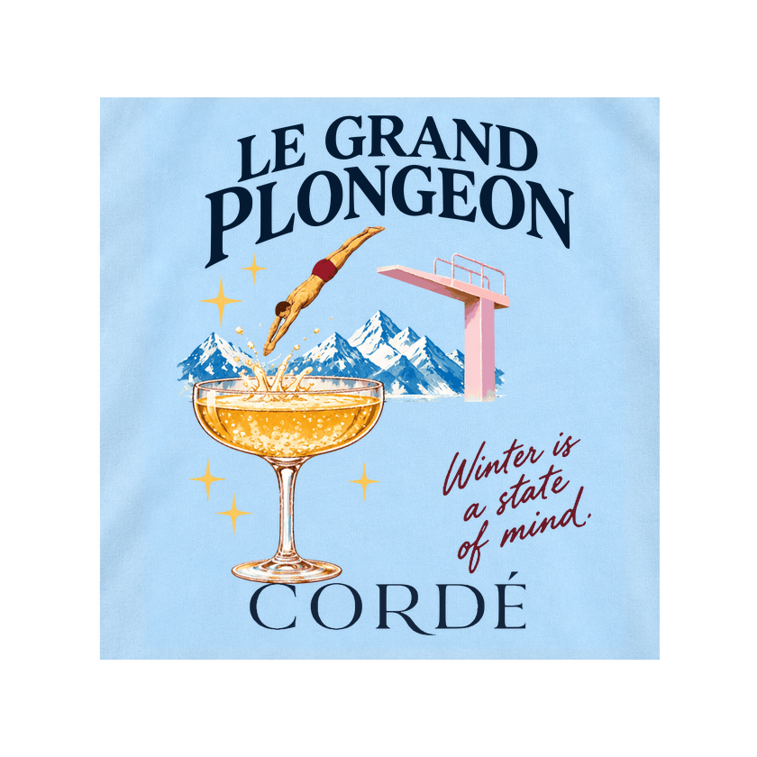 CORDÉ Powder Blue T-shirt, back detail: diver, champagne coupe and snowy mountains.